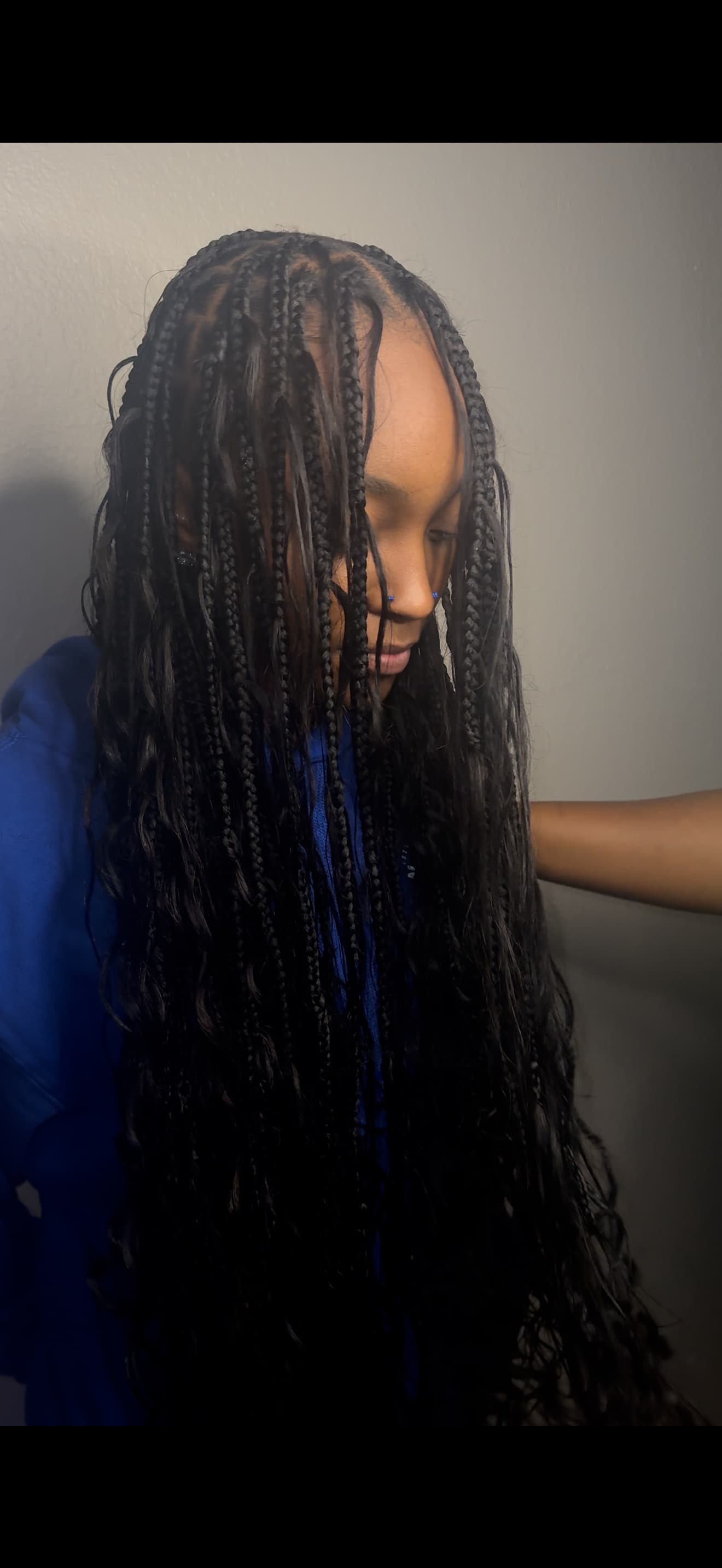 Front view of boho braids styled by Rooted In Soul